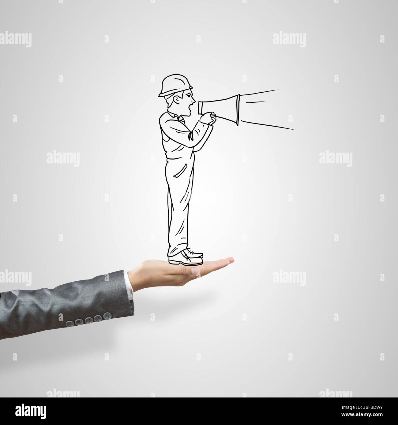 Drawn businessman in female palm on gray background Stock Photo