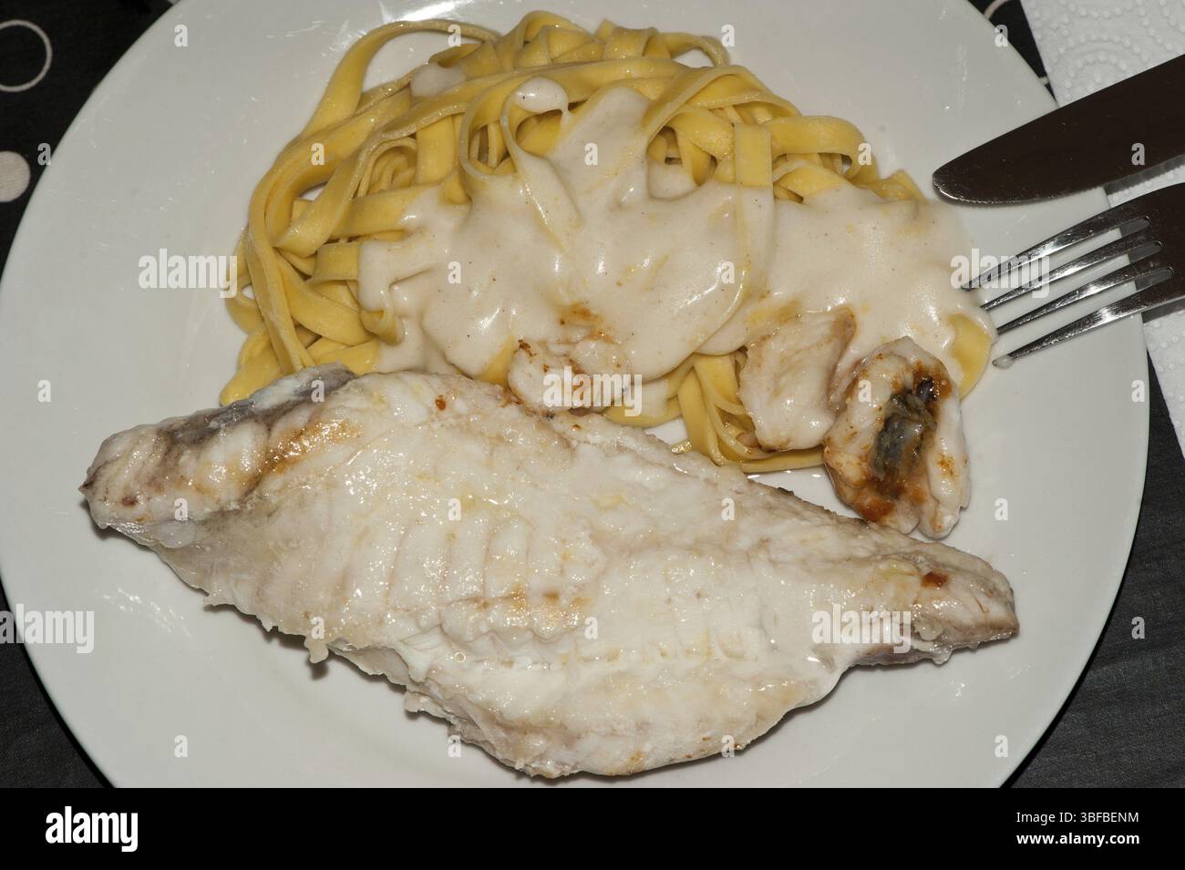 Monkfish fillet with tagliatelle (Lophius piscatorius Stock Photo - Alamy