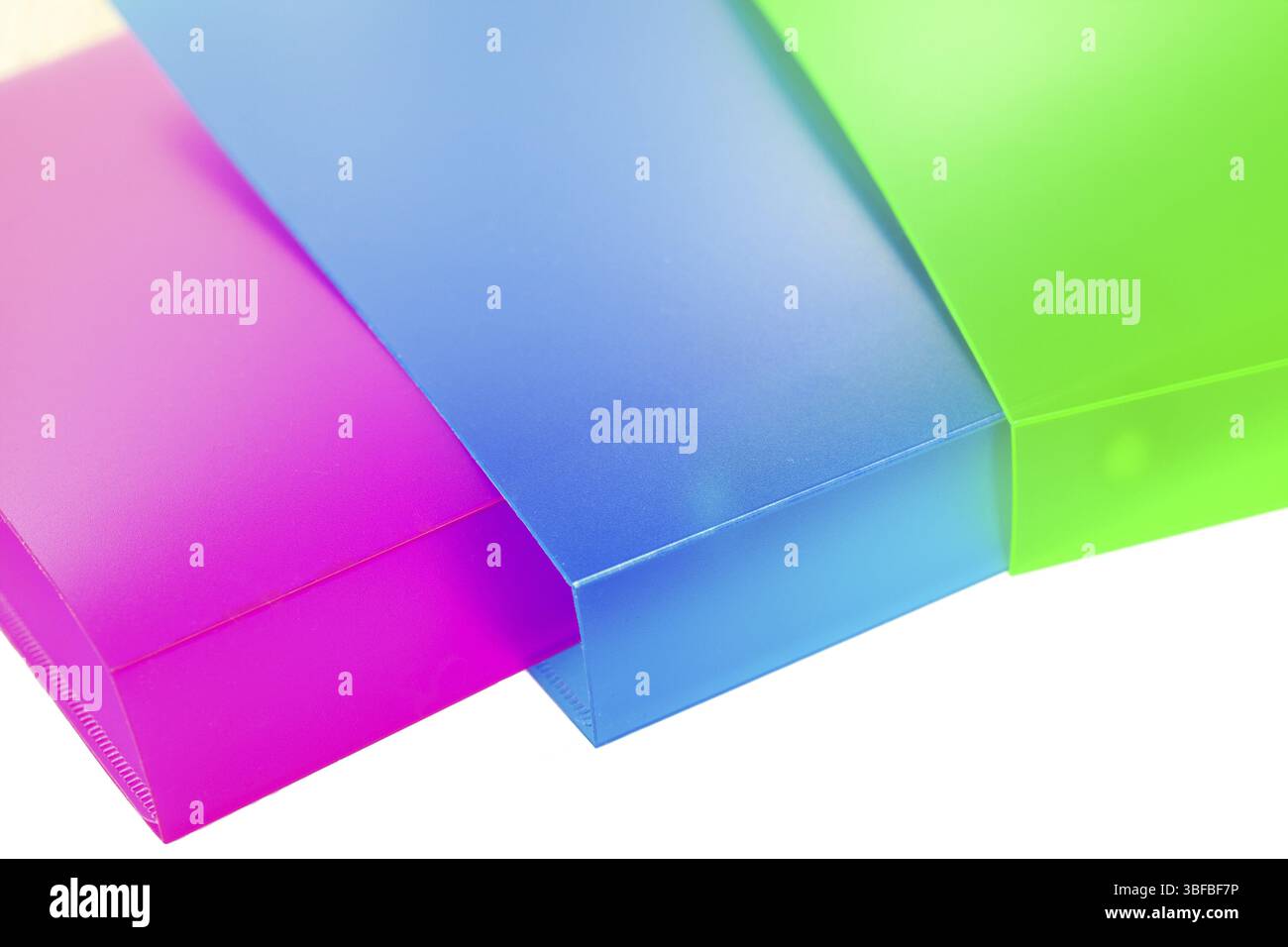 Three multicolored folders on white background Stock Photo