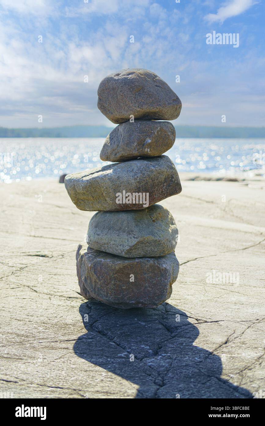 Stacked Rocks balancing, stacking with precision. Stone tower on the shore. Copy space Stock Photo