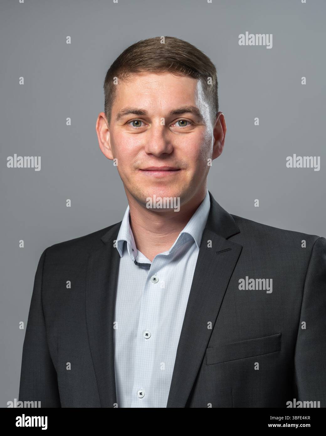 Stylish young man in business casual jacket, smiling with confidence ...