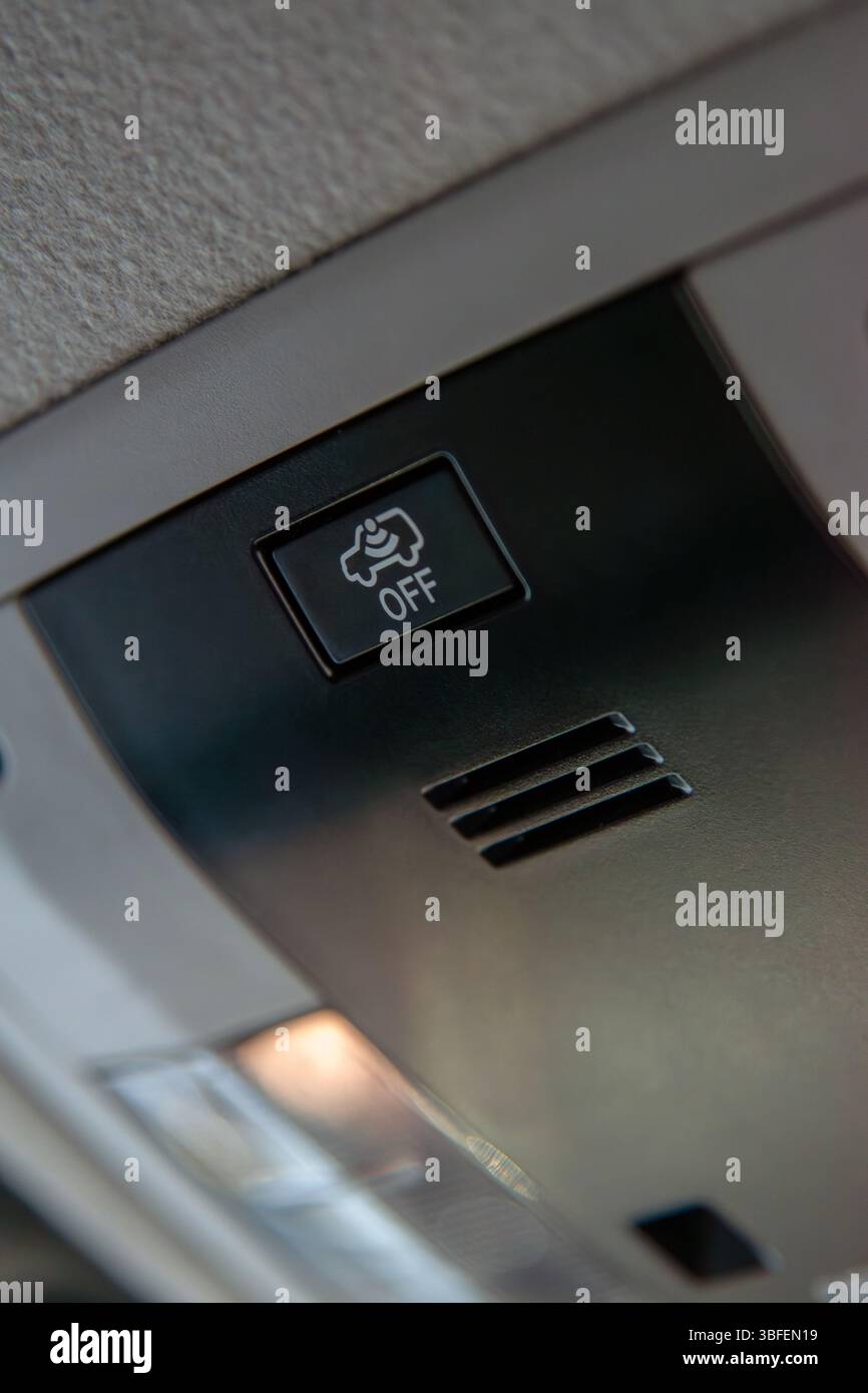 Close up of cabin car ceiling lamp, light control panel inside interior. Off button. Stock Photo