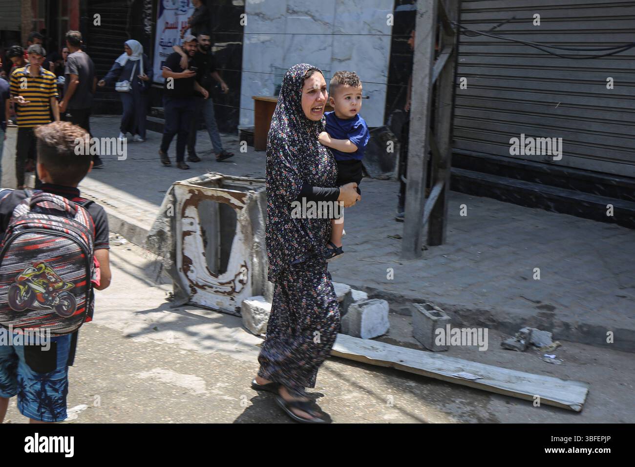 Palestinian Faecs Palestinians cover their faces as they walk amid dust and smoke after ...