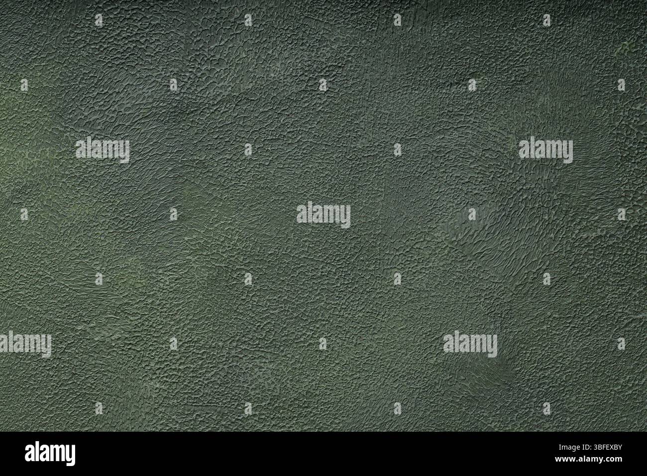 Dark Green Textured Background Abstract Decorative Plaster Wall Surface with Rough Uneven Pattern Stock Photo