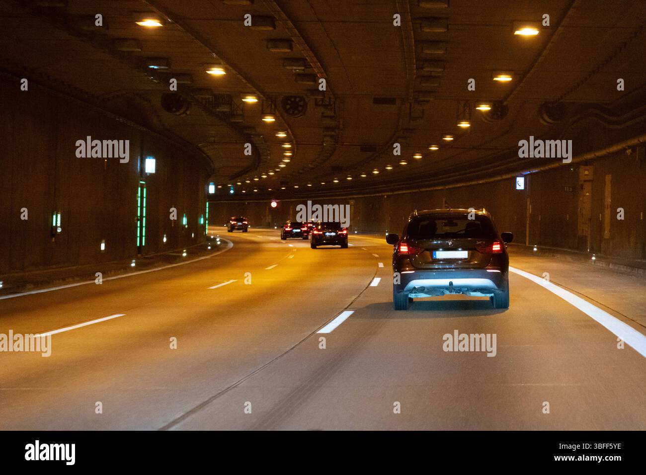 Munich, Bavaria, Germany - May 30, 2025: The Allach Tunnel near Munich shows flowing traffic under modern LED lighting, with clear roadway guidance *** Der Tunnel Allach bei München zeigt fließenden Verkehr unter moderner LED-Beleuchtung, mit klarer Fahrbahnführung Stock Photo