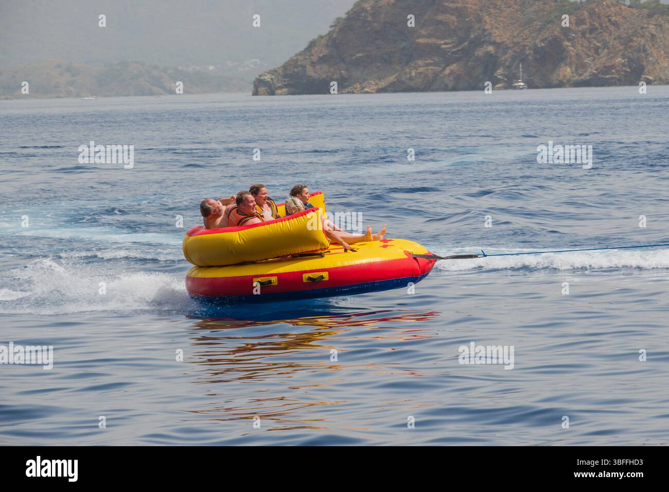 Ringo Boat Ride thrilling watersports adventure, bouncing over the waves on a yellow ...