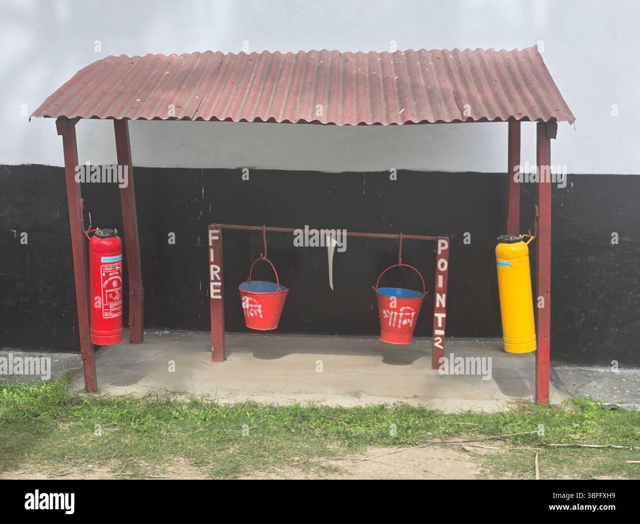 Rustic fire point station with buckets and extinguishers - Smartphone Captured Stock Image