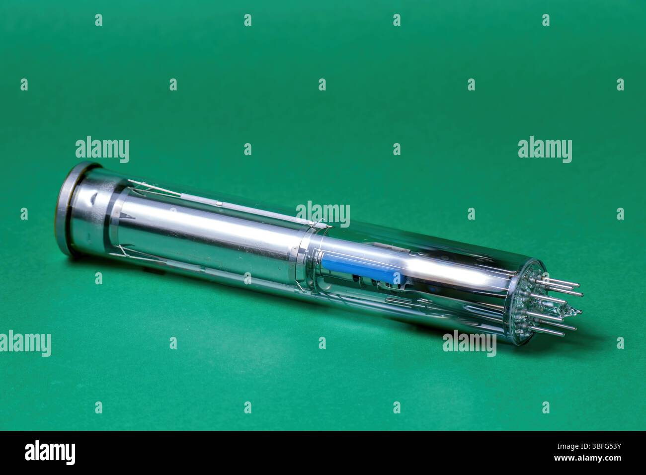 vintage video camera tube with detailed internal components against a green background Stock Photo