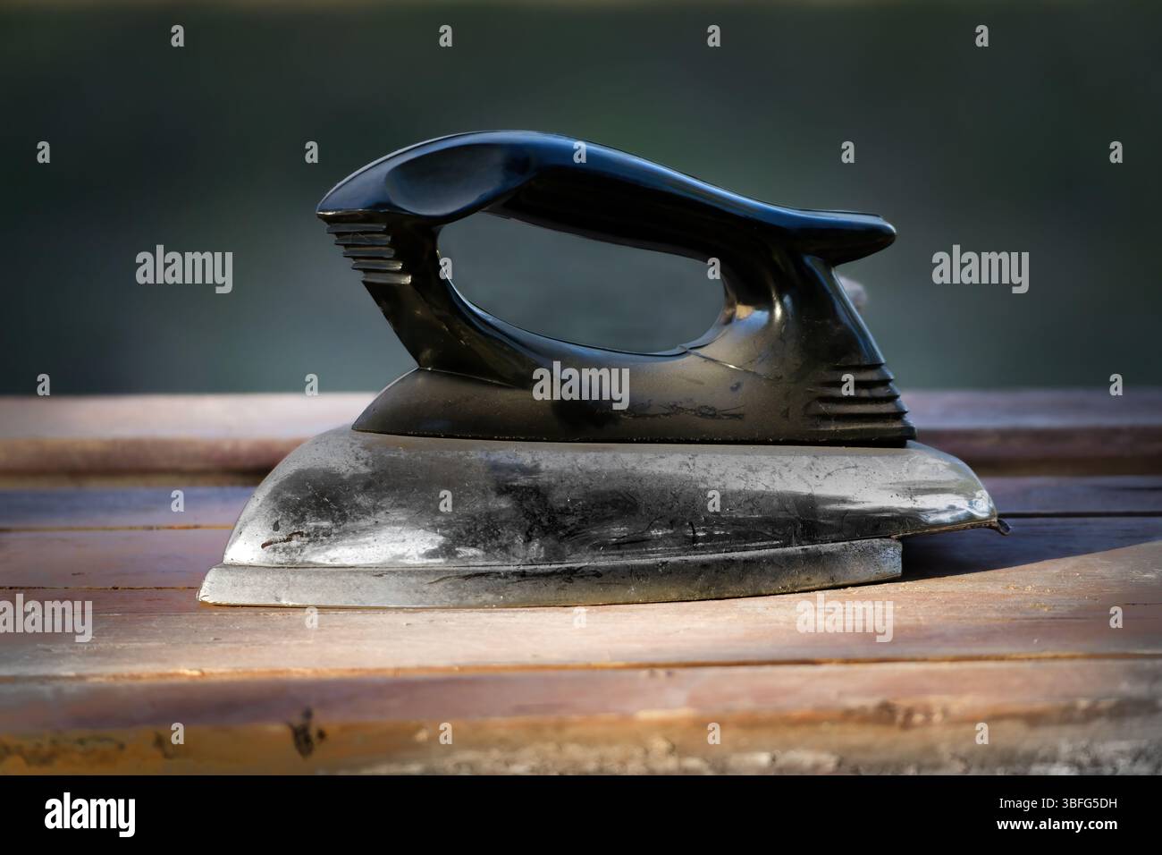 Antique electric Iron. Tool for Traditional Clothes Pressing Stock Photo