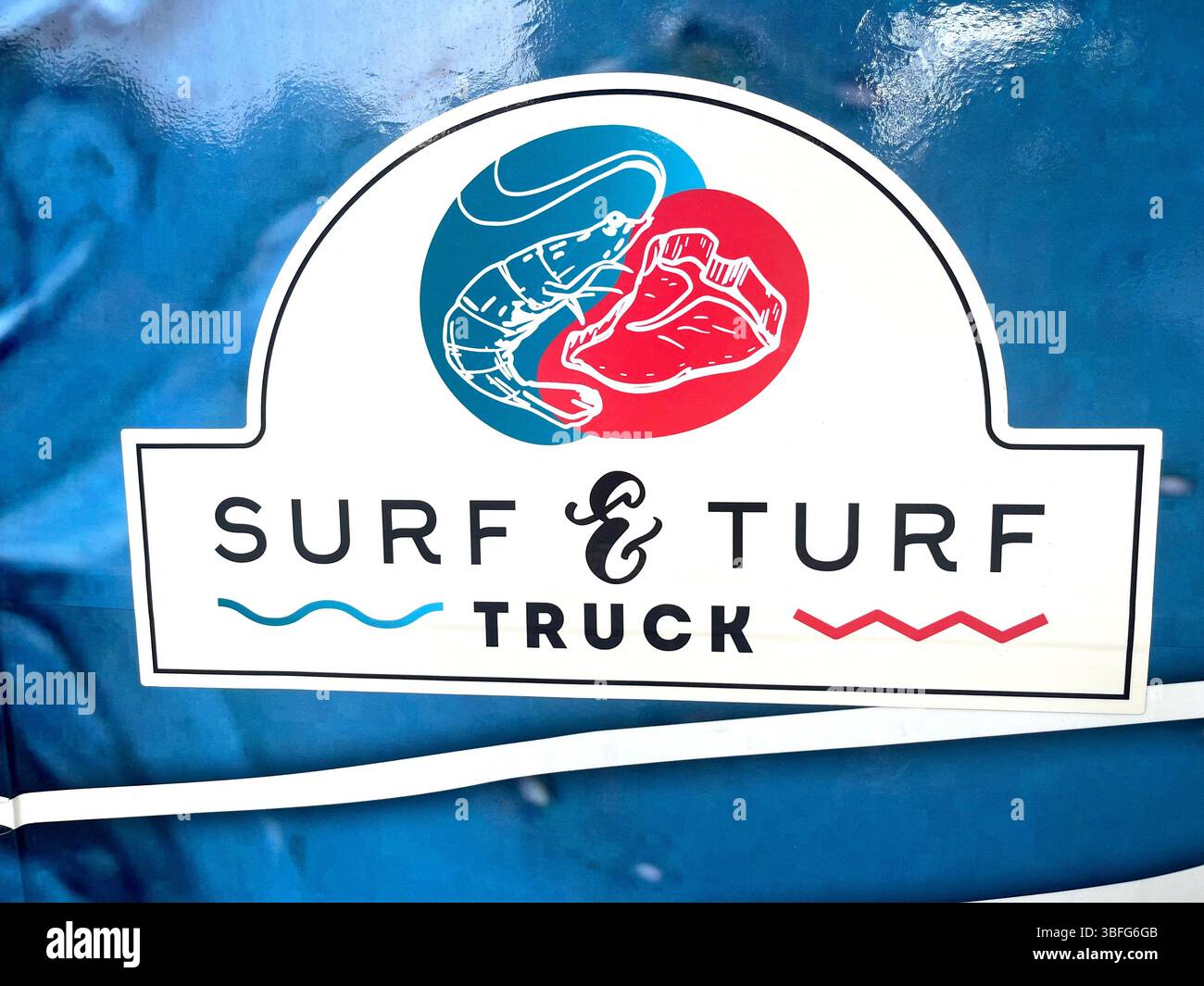 Surf&Turf food truck livery on street food van - Smartphone Captured Stock Image