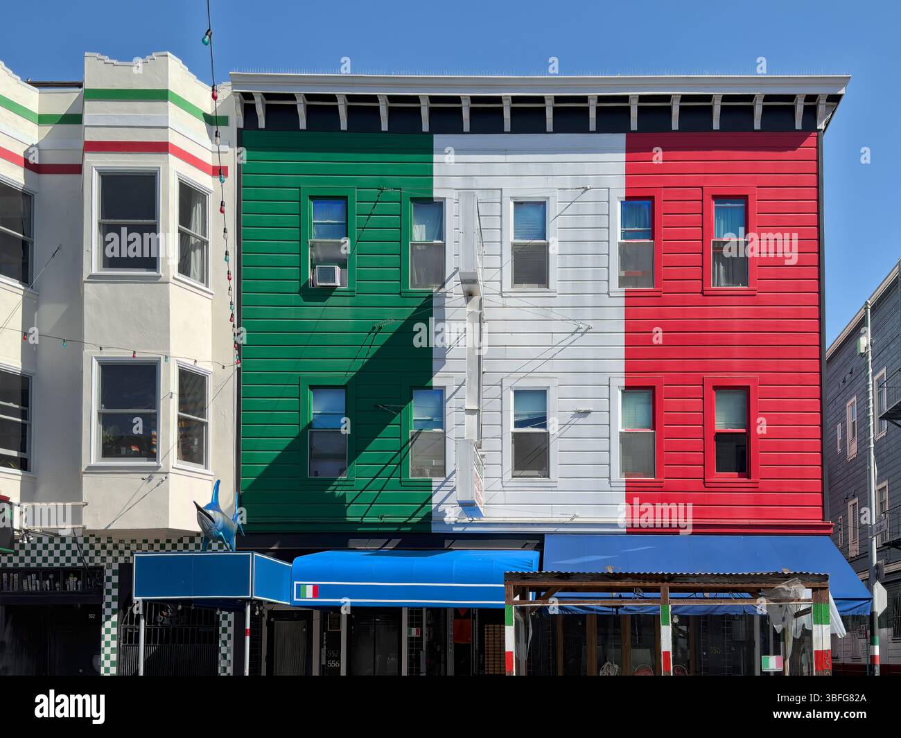 Italian Sect San Francisco, California - 05-05-2025: Building painted in the colors ...