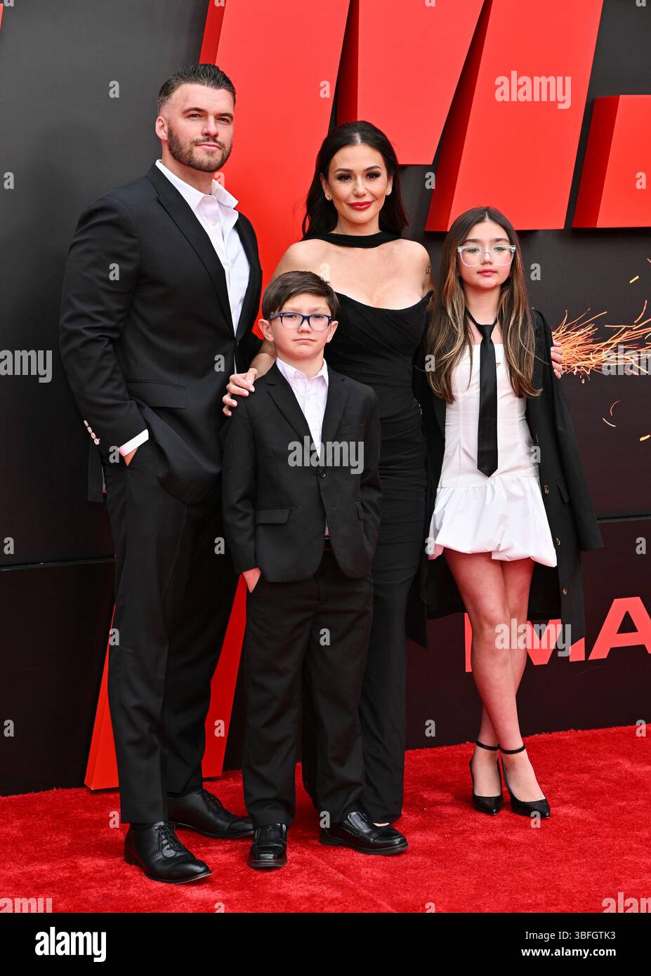 Jenni "JWOWW" Farley poses with husband Roger Mathews and their kids