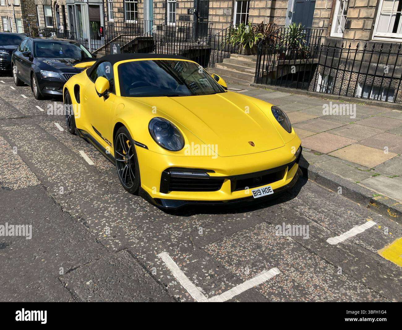 Yellow Porsche 911 Turbo S, parked up in the street, Edinburgh Scotland Stock Photo