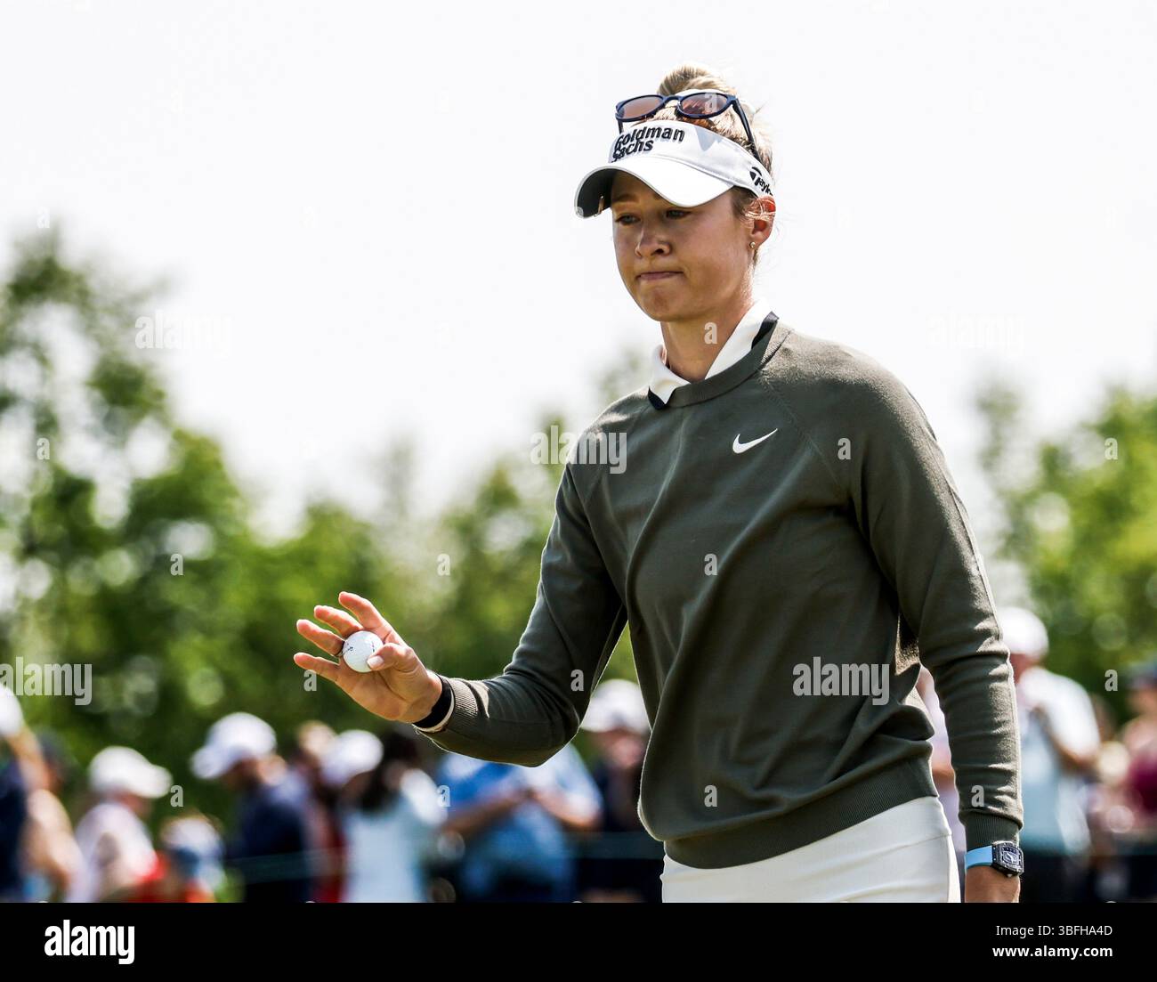 Nelly Korda of the US holds her ball after putting on the 7th green
