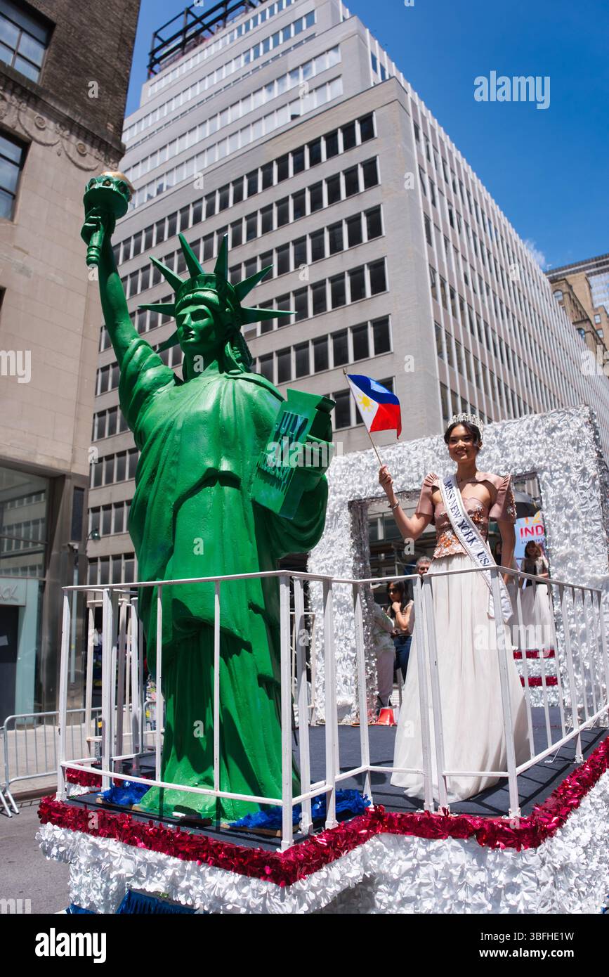 A green Statue of Liberty replica stands beside a young woman in a ...