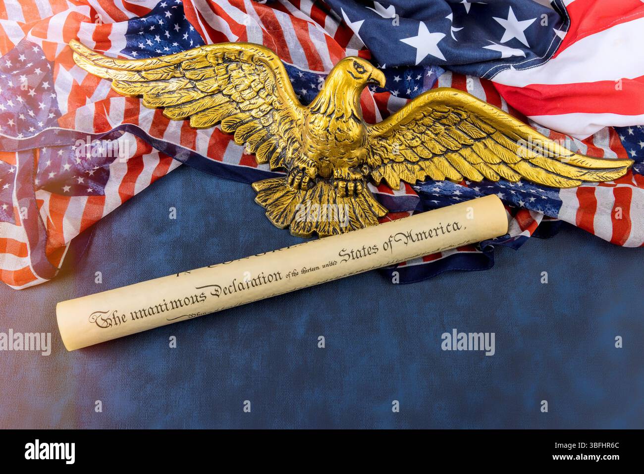 Rolled Declaration of Independence lies beside an eagle emblem on ...