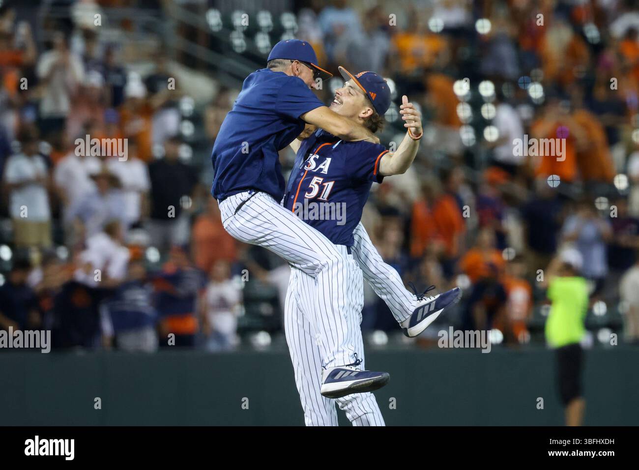 AUSTIN, TX - JUNE 01: UTSA head coach Pat Hallmark jumps into the arms ...
