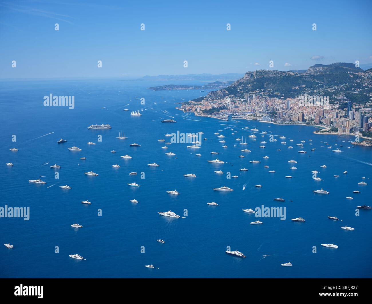 AERIAL VIEW. Numerous mega yachts anchored in the Bay of Roquebrune on ...