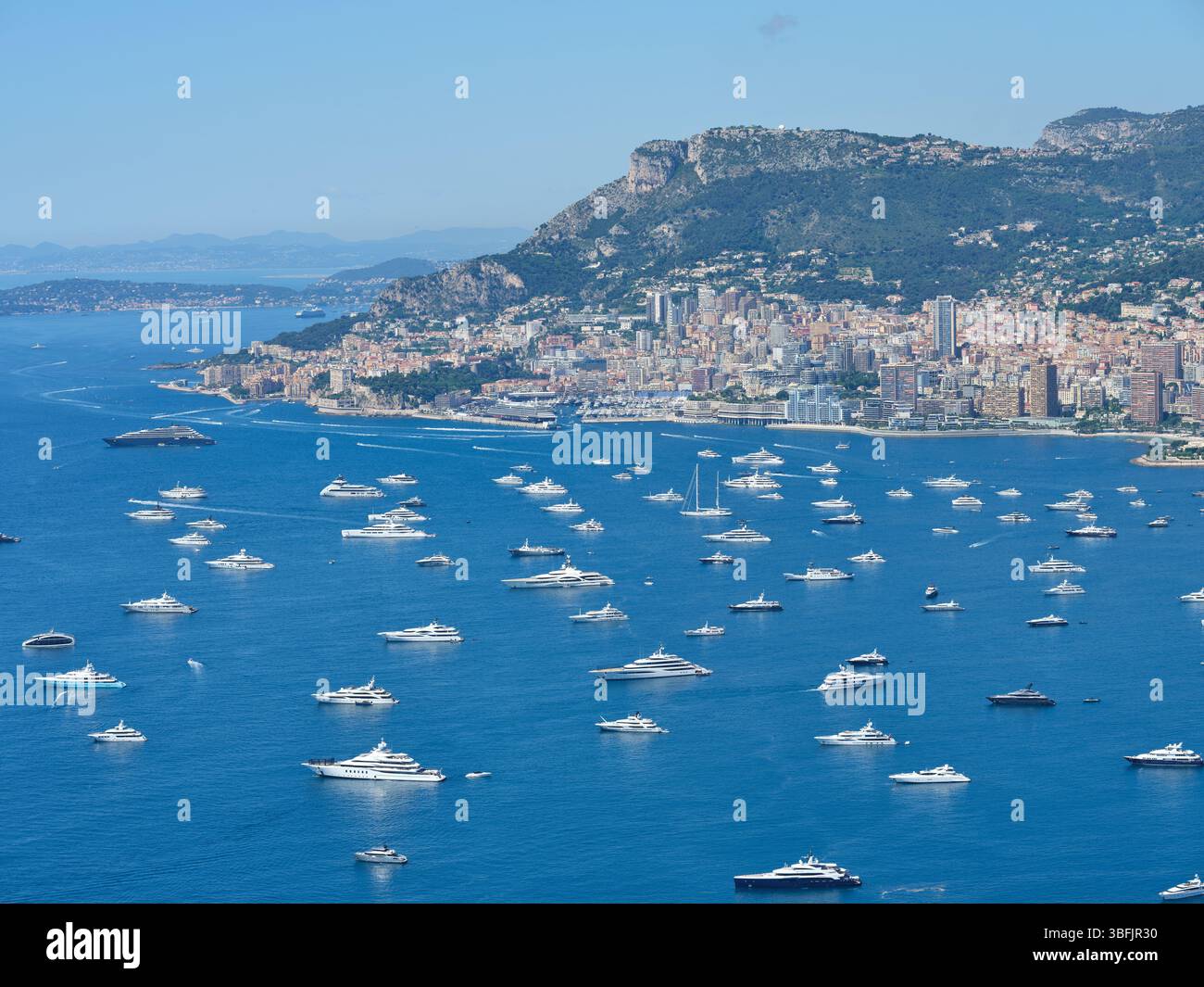 AERIAL VIEW. Numerous mega yachts anchored in the Bay of Roquebrune on ...