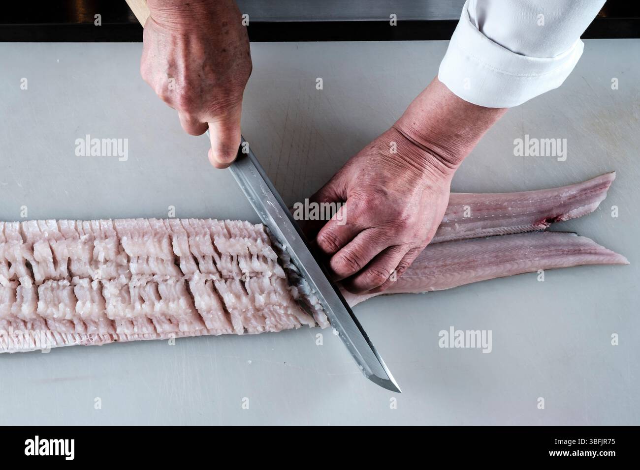 Japanese chef cutting hamo fish at Awaji Island restaurant Stock Photo ...