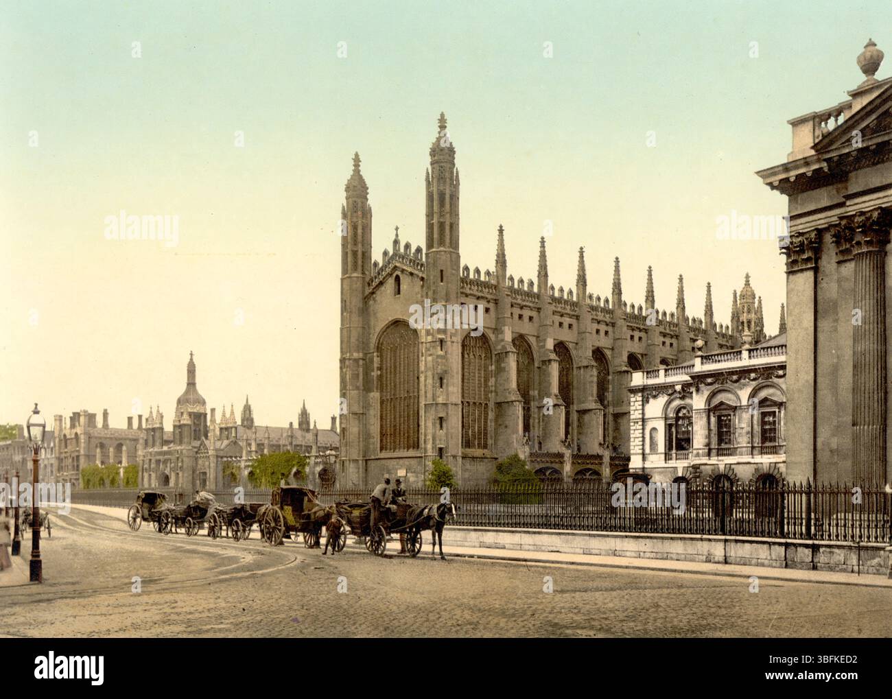 King’s College, University of Cambridge, England, Colourised historic photograph featuring 19th-century architecture and landscaped grounds Stock Photo