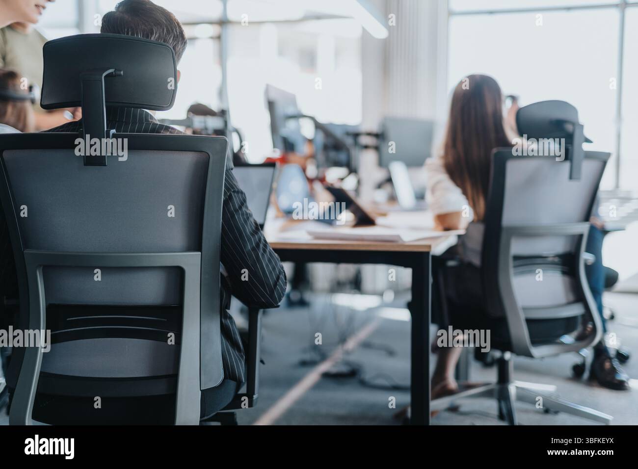Modern office workspace with diverse employees collaborating together ...