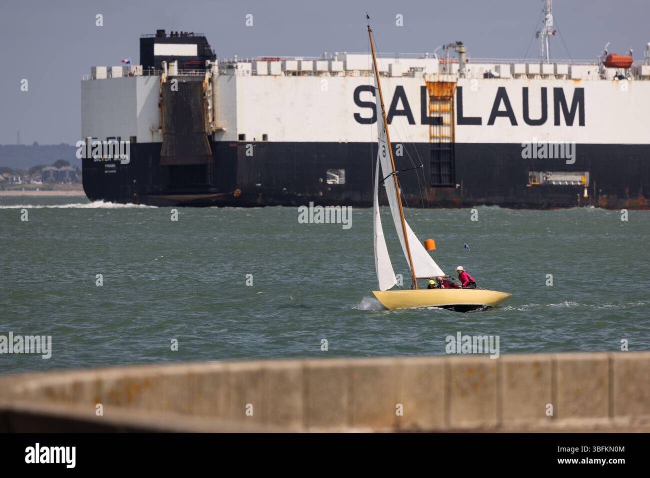 Cowes, Isle of Wight, UK. 1st June, 2025. A classic yacht sails past the ro-ro vessel SILVER MOON during Cowes Classic regatta events off Cowes, Isle of Wight, UK. 2nd June, 2025. Credit: Will Beresford/Alamy Live News Stock Photo