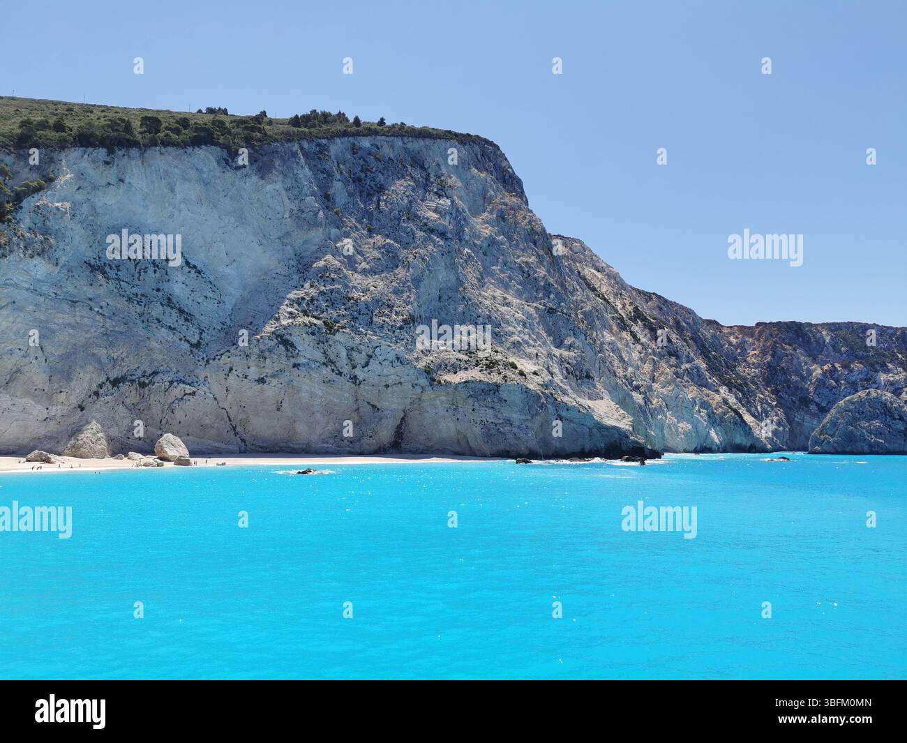 The white cliffs and turquoise waters of Egremni beach on the western side of Lefkada island in Greece. This stunning area can only be reached by boat. - Smartphone Captured Stock Image