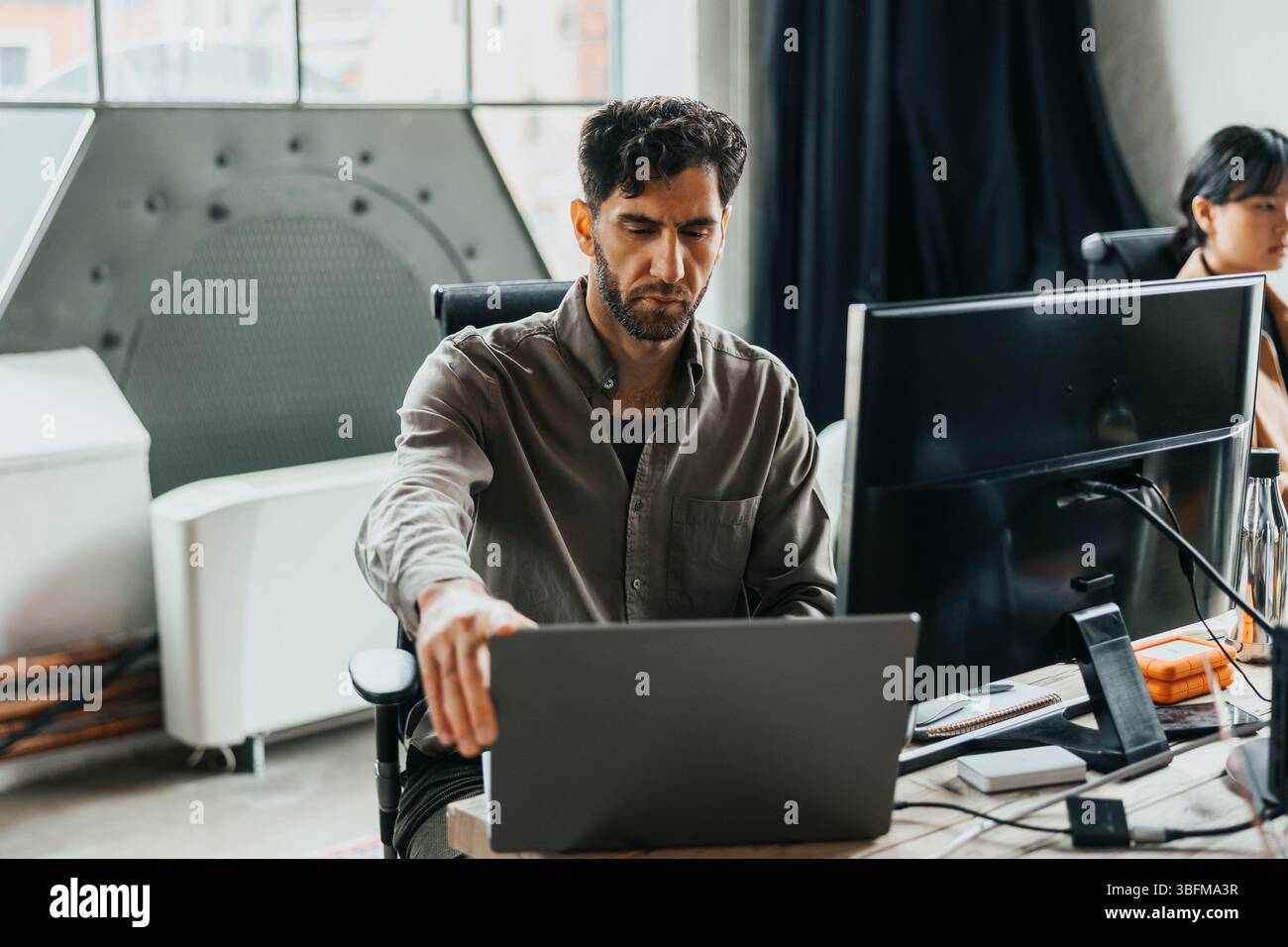 Male computer programmer working with modern technologies at office Stock Photo
