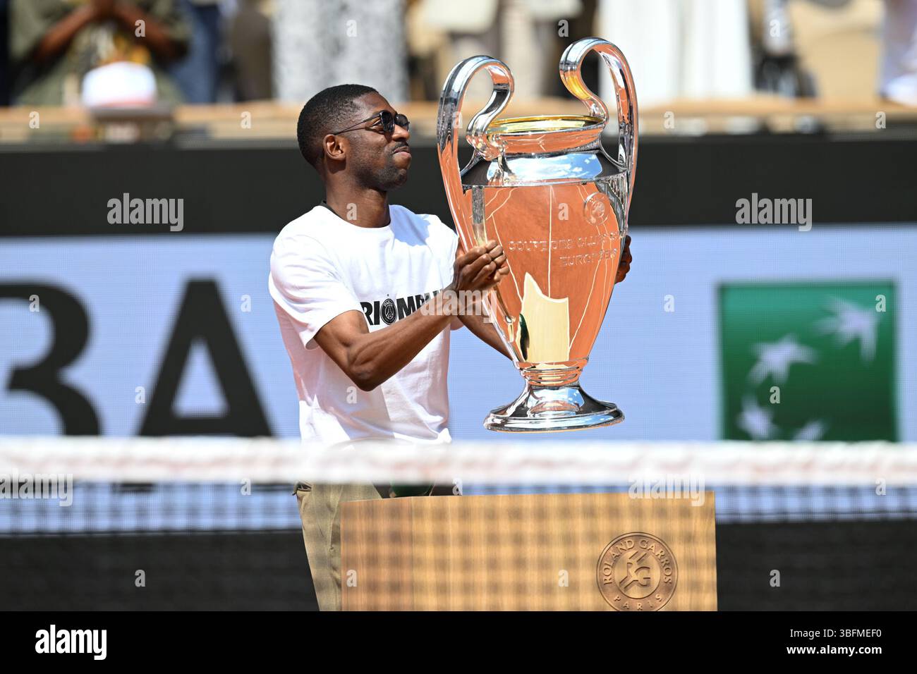 Ousmane Dembele of Paris Saint Germain with the UCL Trophy during