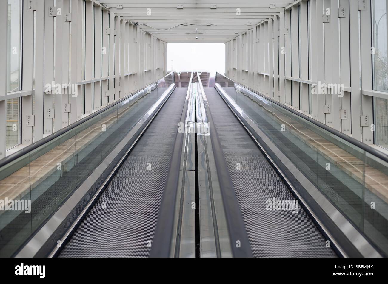 Empty travelator glass handrails without hi-res stock photography and ...