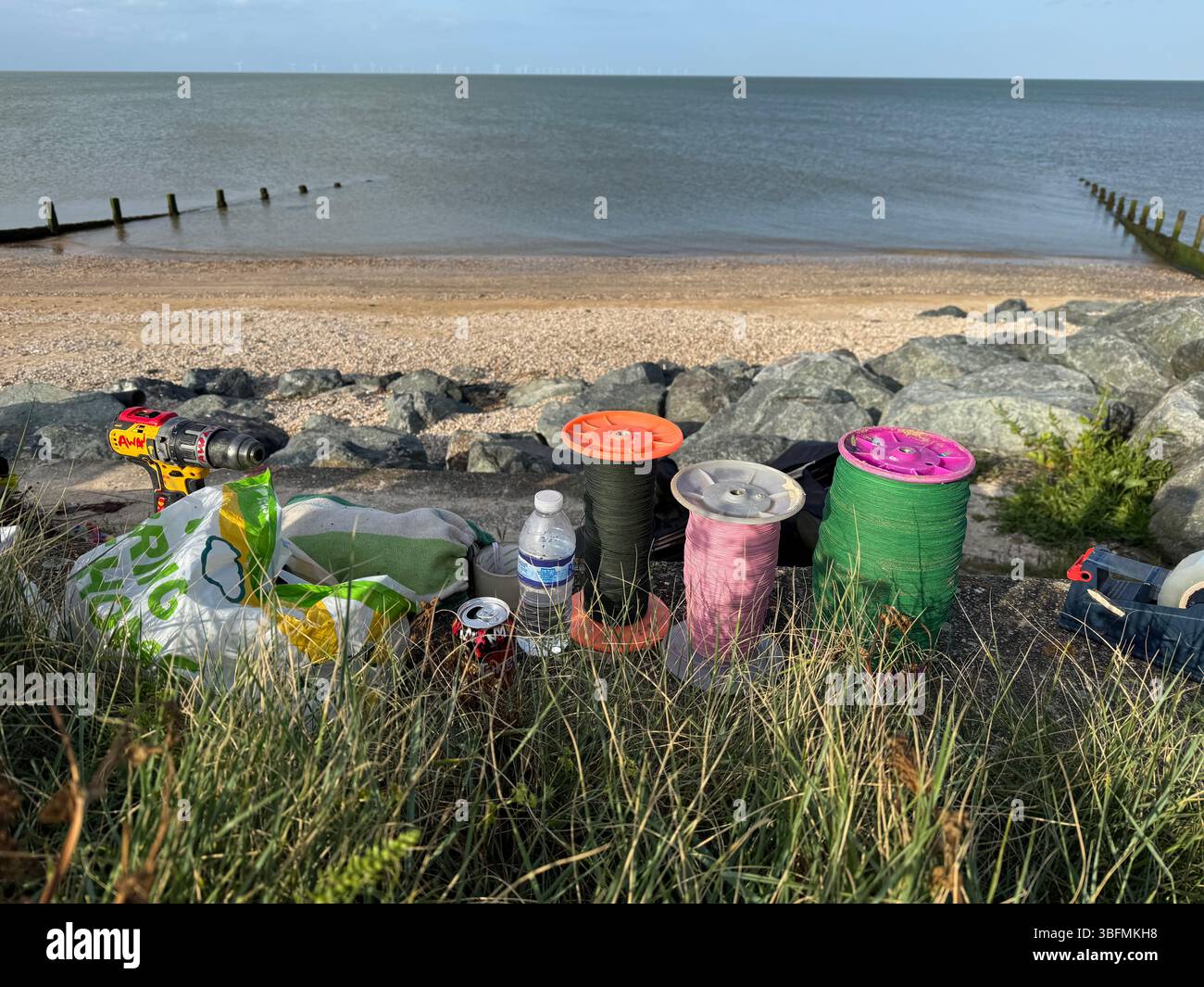 Friends from East London, Birmingham and Pakistan competing in a kite flying competition in Leysdown on sea in Kent, UK Stock Photo