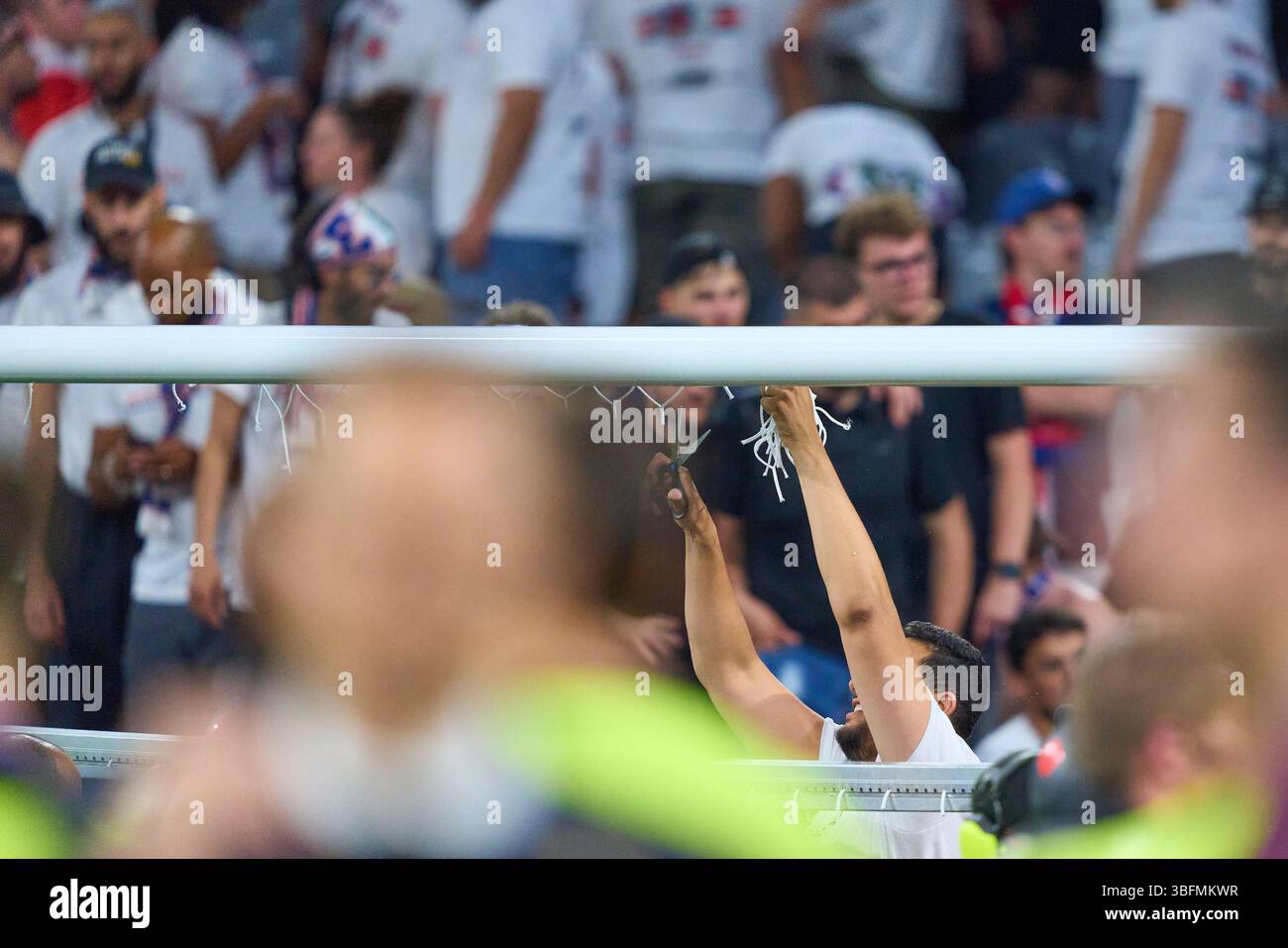 Fans cut pieces of the goal net after the match PSG PARIS - INTER ...