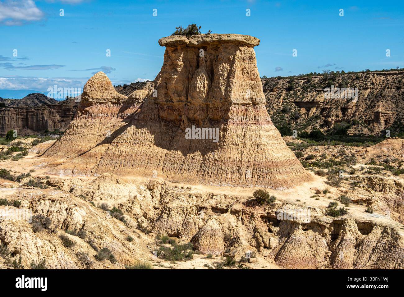 Tozal Solitario rock formation, desert, along gravel road Ruta Jubierre, Desierto de los Monegros, Spain Stock Photo