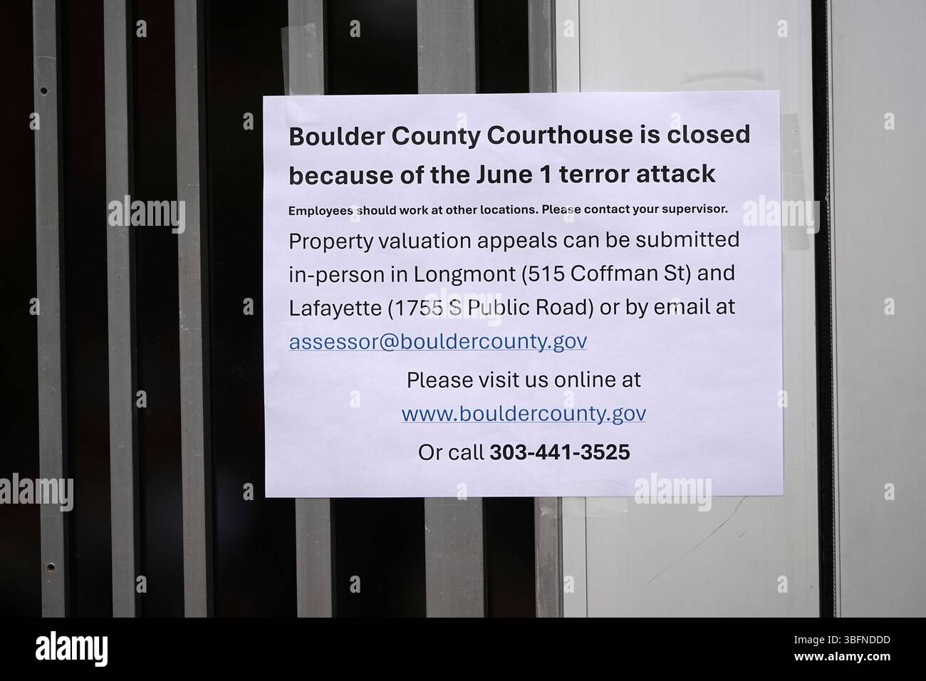 A closed sign hangs on the front door of the Boulder County, Colo ...