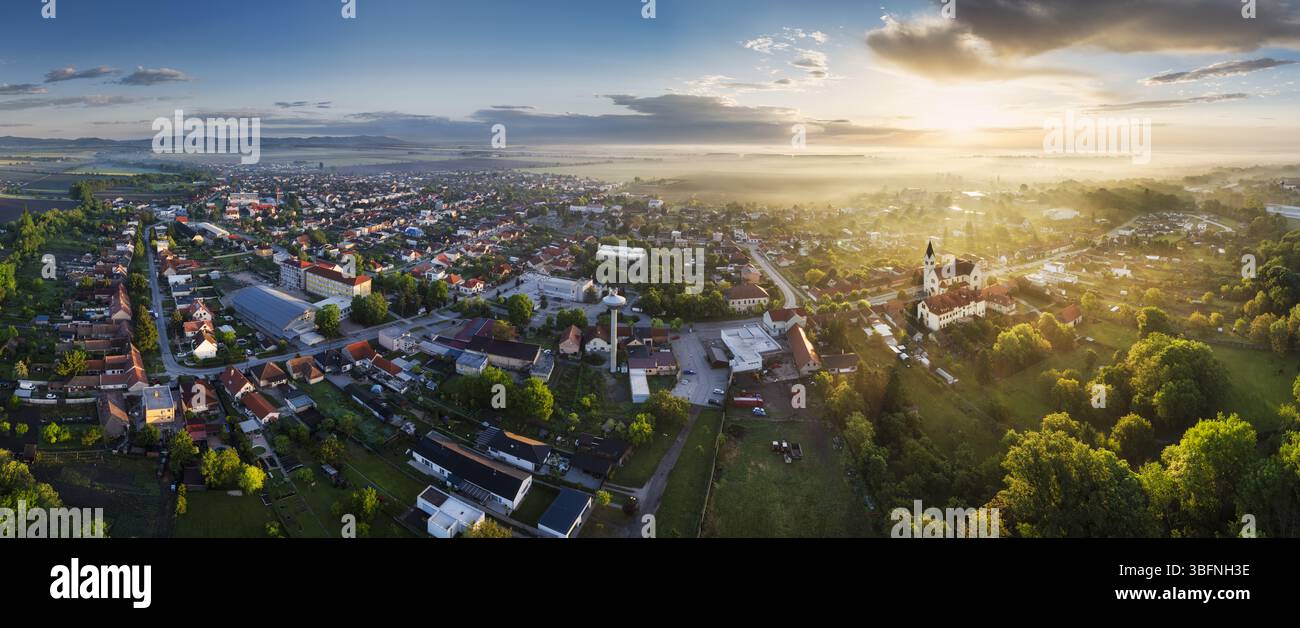 Lovely rural countryside in beautiful sunlight at sunrise with fog. Amazing landscape Stock Photo