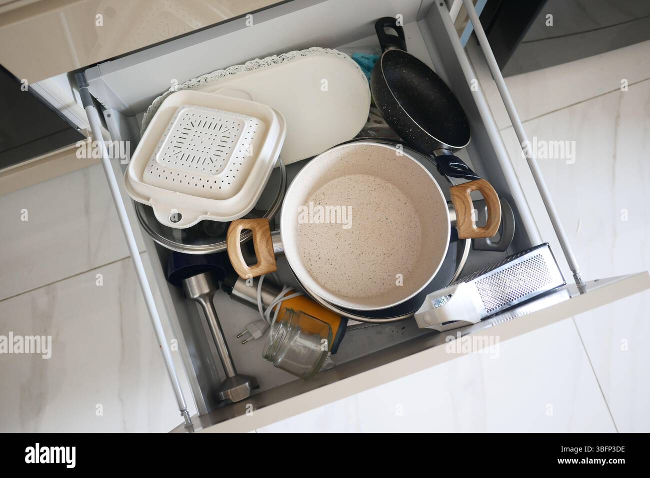 Kitchen drawer with various utensils and tools Stock Photo