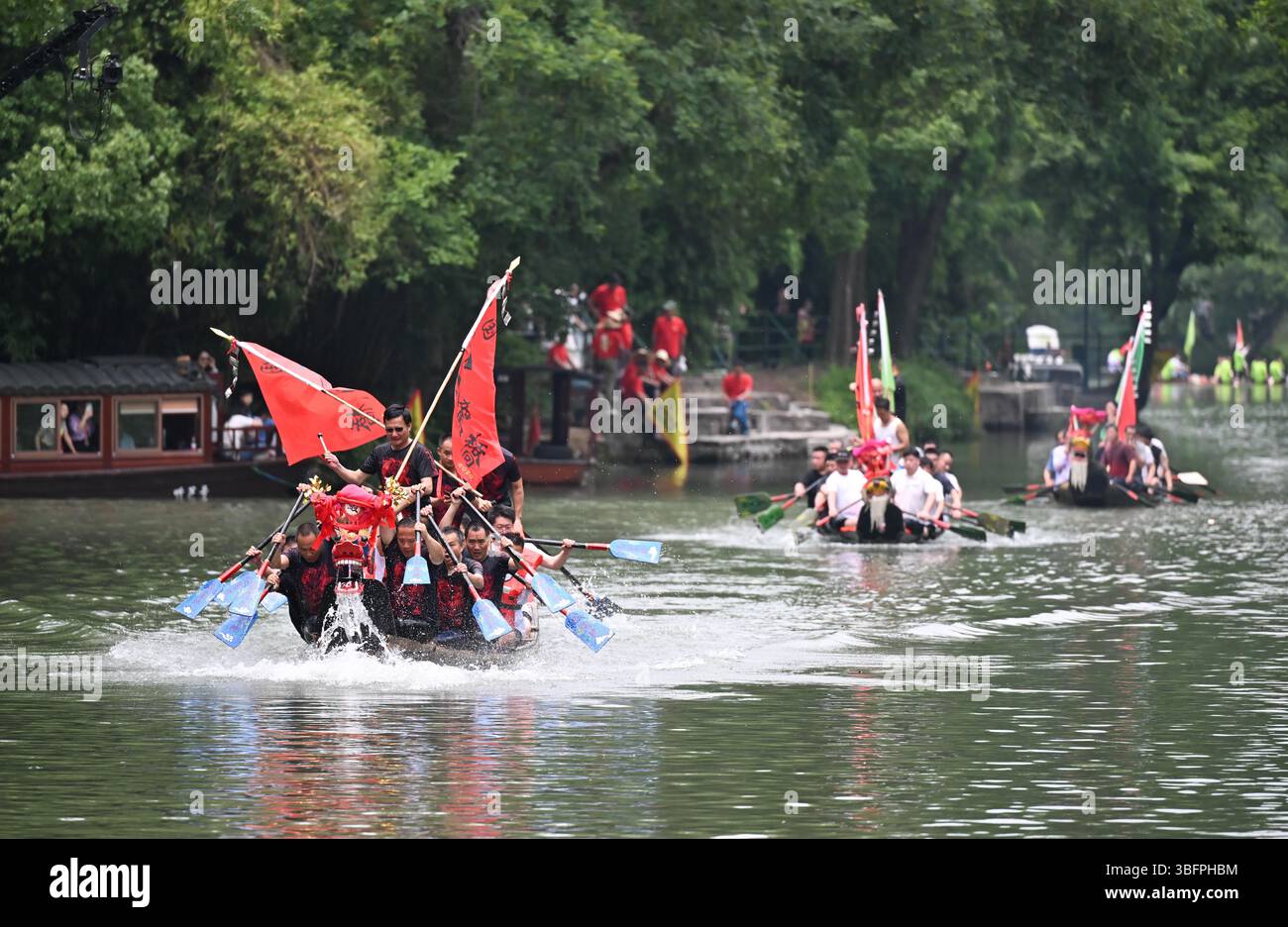 **CHINESE MAINLAND, HONG KONG, MACAU AND TAIWAN OUT** People row dragon