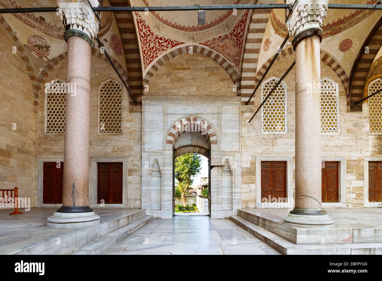 istanbul, turkiye - aug 18 2015: court of blue mosque. open door between columns Stock Photo