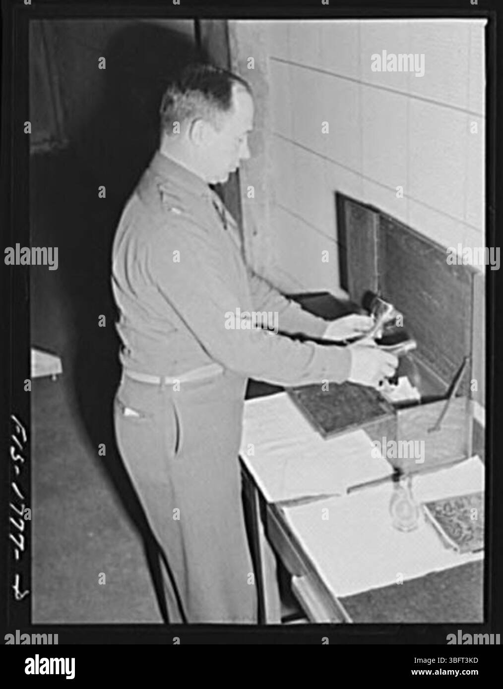 Chaplain P. S. Hall of Upper Darby, Pennsylvania, is seen packing his ...