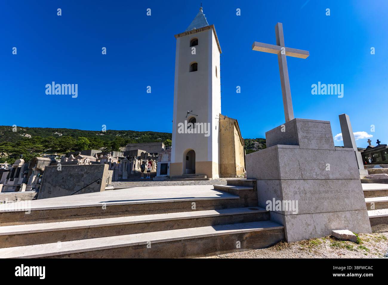 Church of St. John, white cross, bell tower, cemetery on the hill, panorama of the town of Baska on the Island of KRK Stock Photo