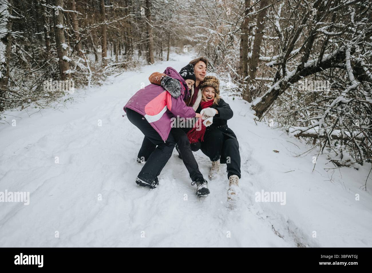 Three friends share a joyful moment in a snowy forest, enjoying winter ...