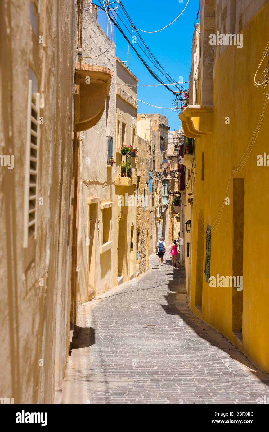 Victoria Rabat Streets Malta street, view in summer of people walking in a narrow side street ...