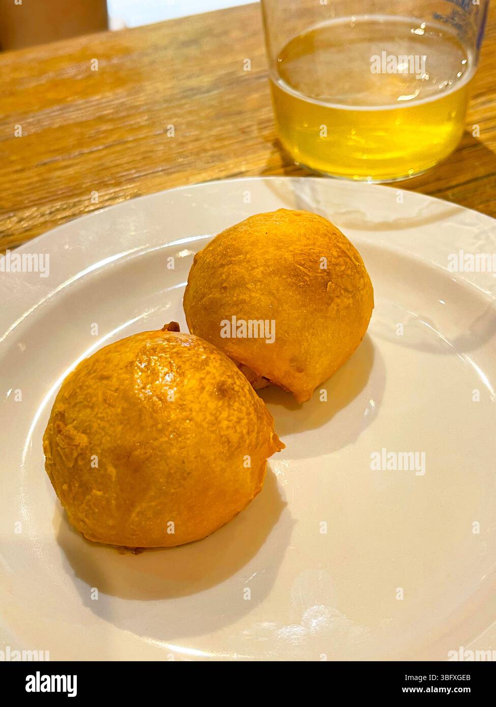 Bollo preñao with glass of cider. Asturias, Spain. - Smartphone Captured Stock Image