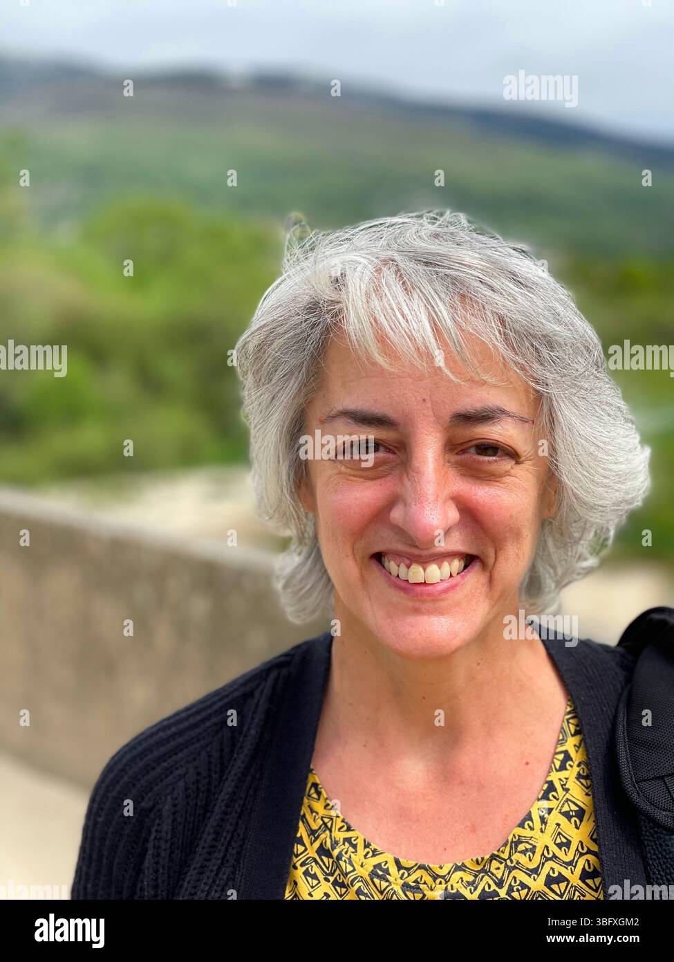 Mature woman smiling and looking at the camera. - Smartphone Captured Stock Image