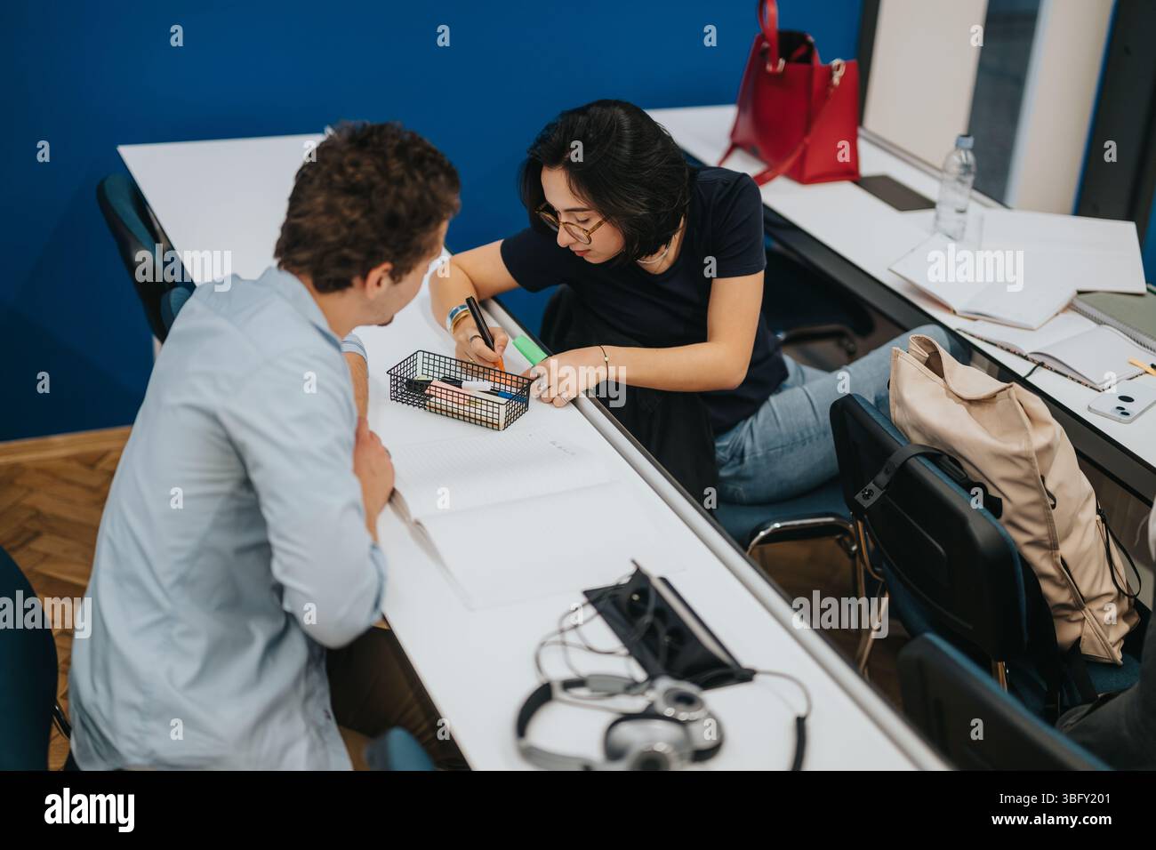 Students engaged in collaborative study session at university Stock Photo