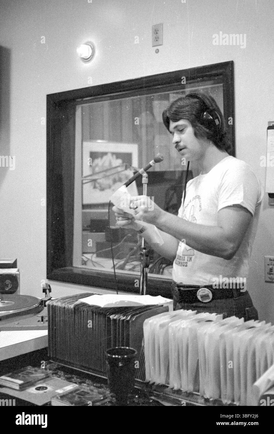 This photo shows WNCI radio DJ E. Karl on air at the Ohio State Fair in 1975. E. Karl was a prominent figure at the radio station, known for engaging with listeners during live broadcasts at public events. Stock Photo