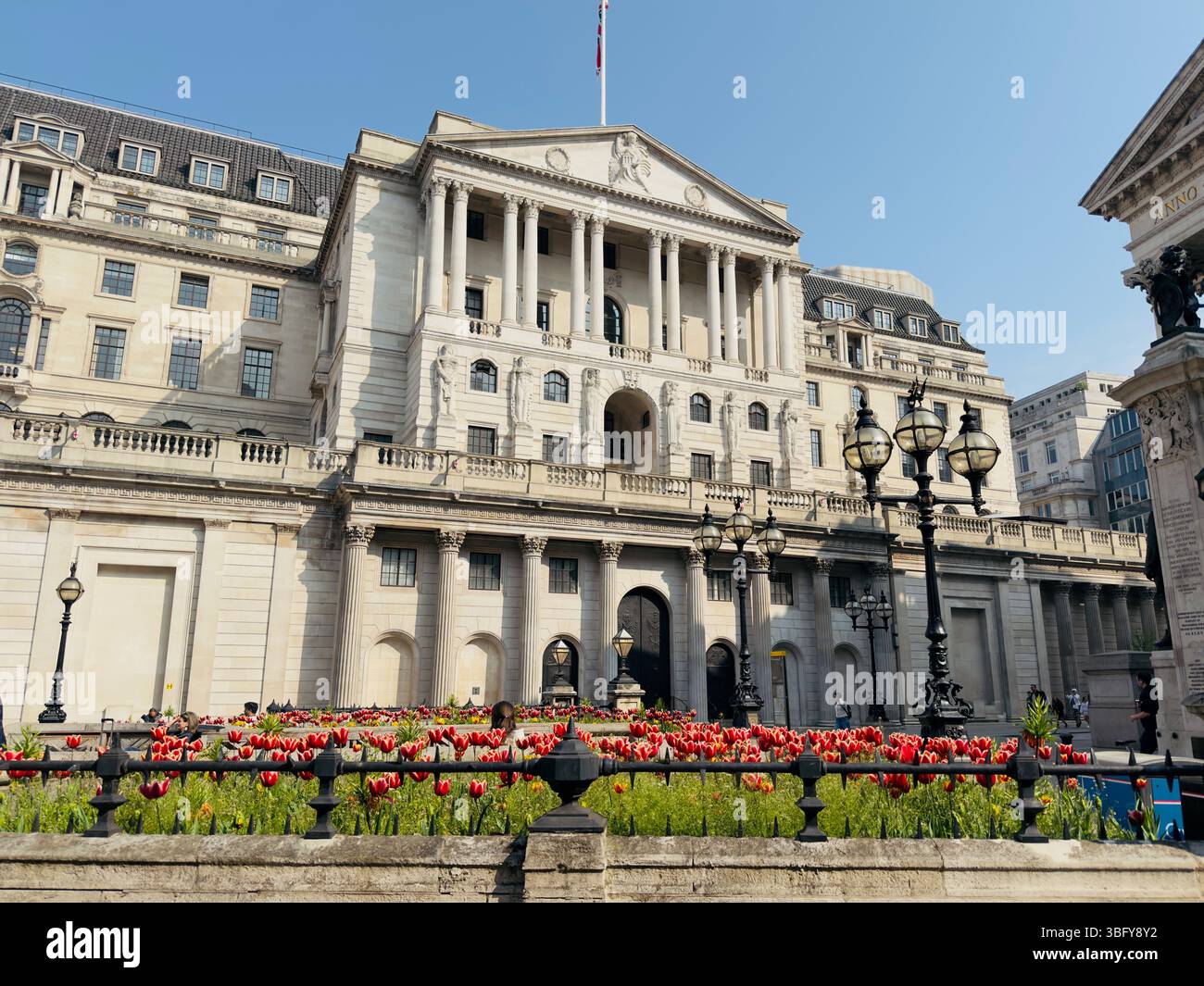 LONDON, ENGLAND – APRIL 27, 2025: The exterior of the Bank of England building under a clear blue sky. - Smartphone Captured Stock Image