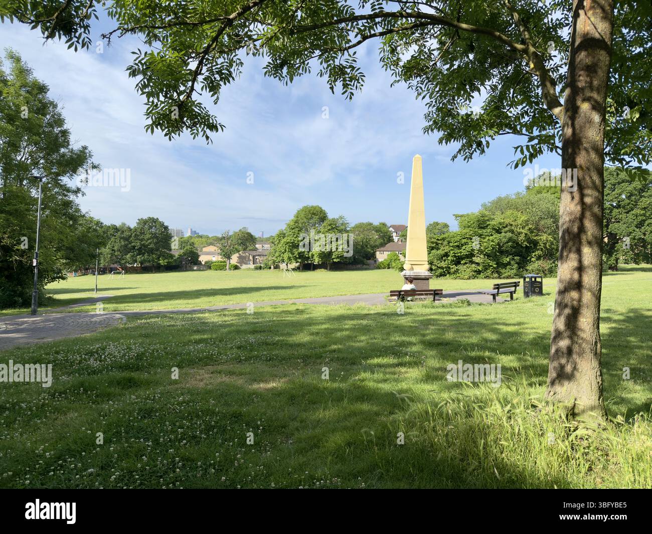 London, England – May 31, 2025: A view of Betts Park in Anerley, featuring a prominent obelisk surrounded by greenery. - Smartphone Captured Stock Image