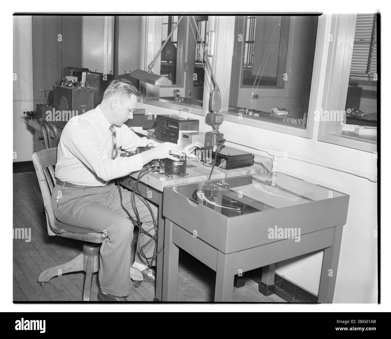 August Aaron calibrates a voltmeter at Dow Chemical Company’s ...